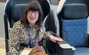 Rocket Girl Coaching's Mary Doyle, in her wheelchair, trying the Air4All wheelchair securement system at AIX 2025
